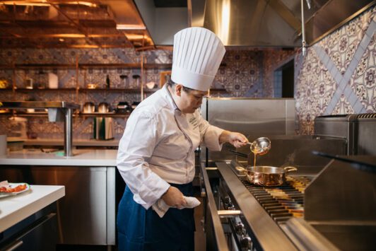 An esteemed chef mans the stove at Casa Don Alfonso located in The Ritz-Carlton, St. Louis.