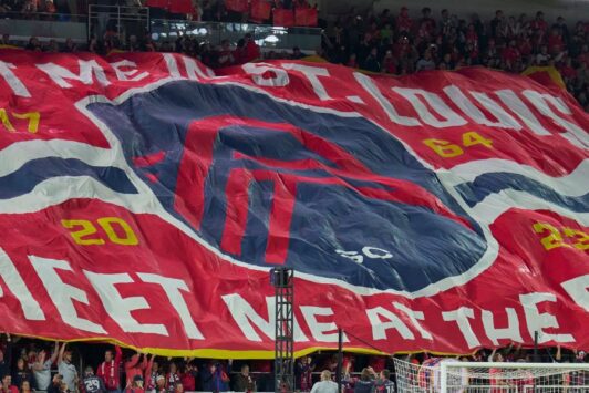 At a St. Louis CITY SC home game, a banner reads, 