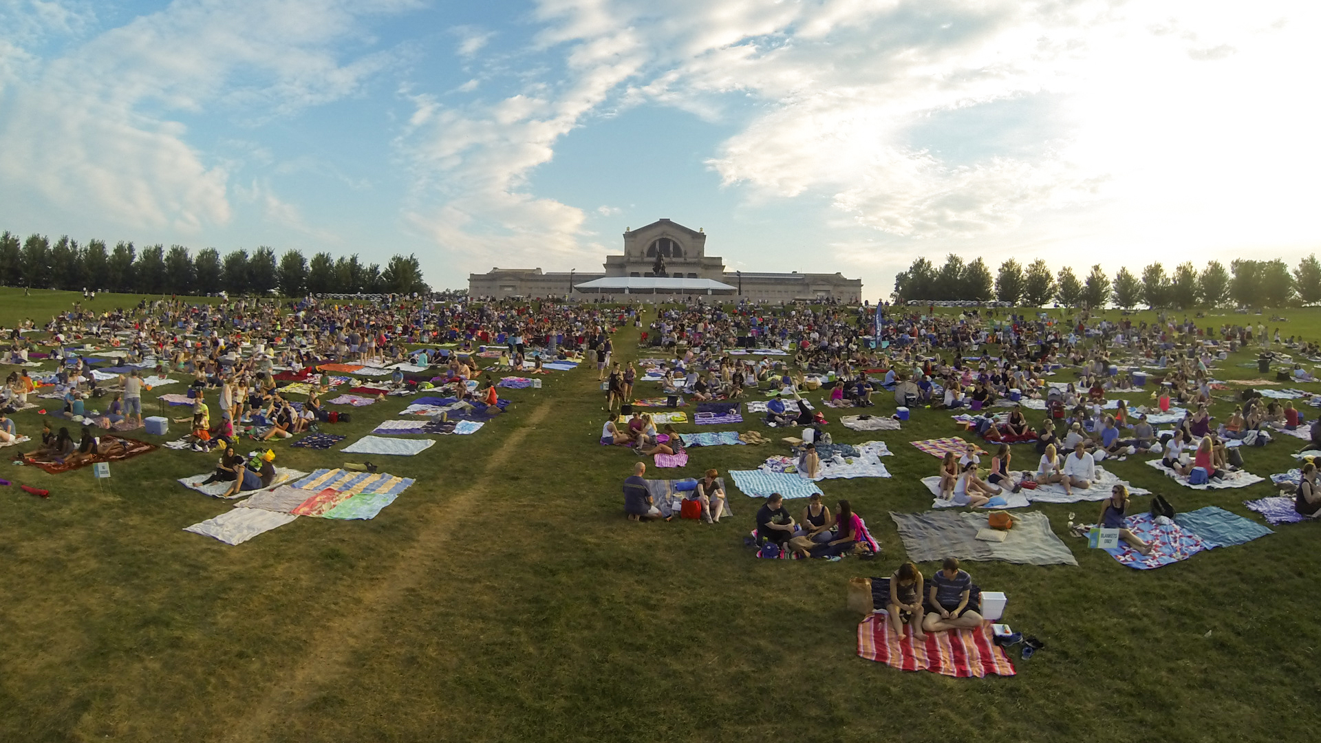 People gather on Art Hill in Forest Park to watch films al fresco.
