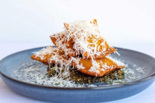 Katie's Pizza and Pasta Osteria serves artichoke toasted ravioli.