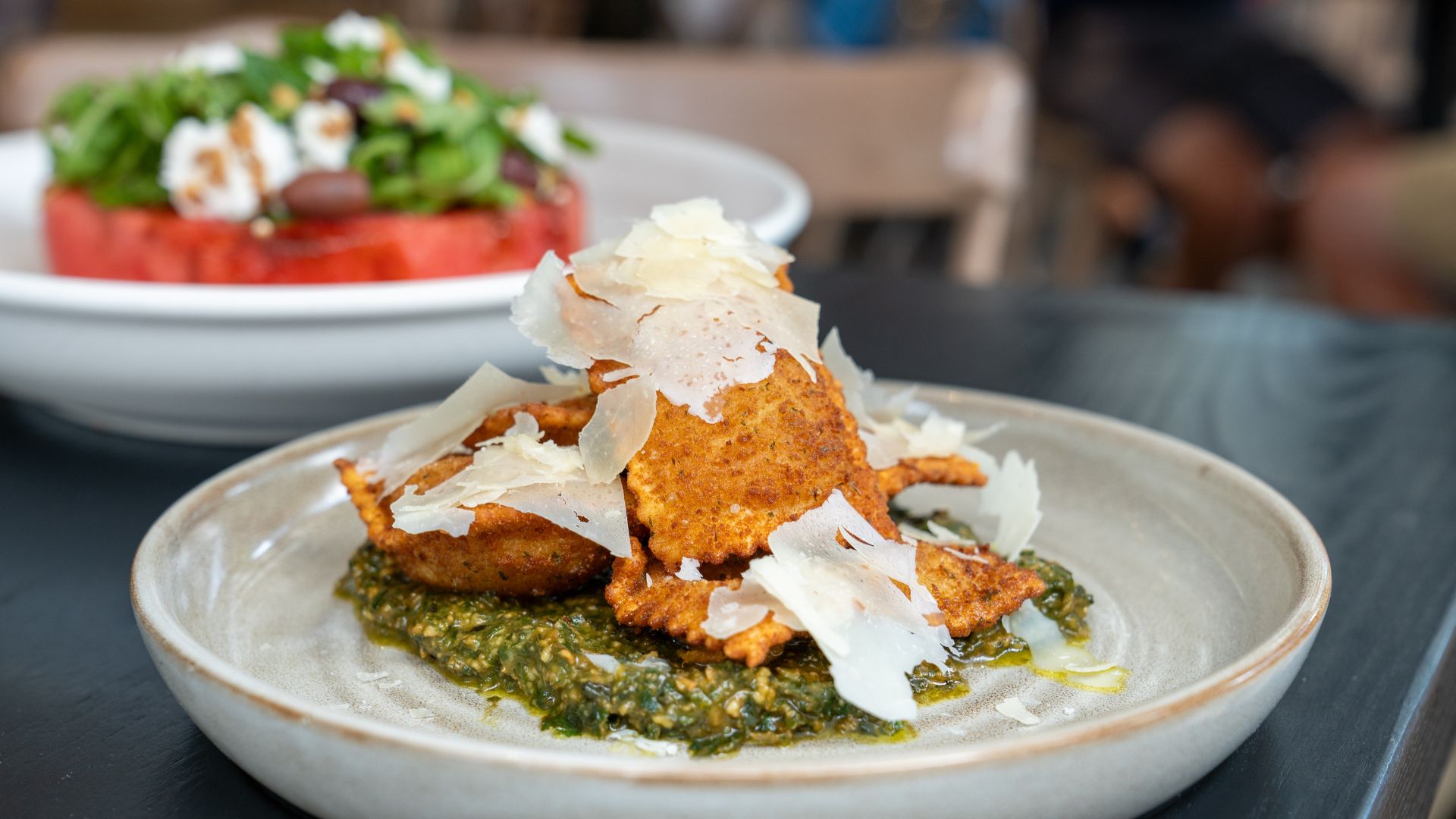 Katie's Pizza and Pasta Osteria serves artichoke toasted ravioli with basil-pine nut pesto.