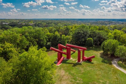 The Way, an outdoor sculpture at Laumeier Sculpture Park, features giant red cylinders.