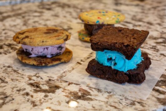 Ice cream sandwiches from Serendipity Homemade Ice Cream line the counter of the shop.