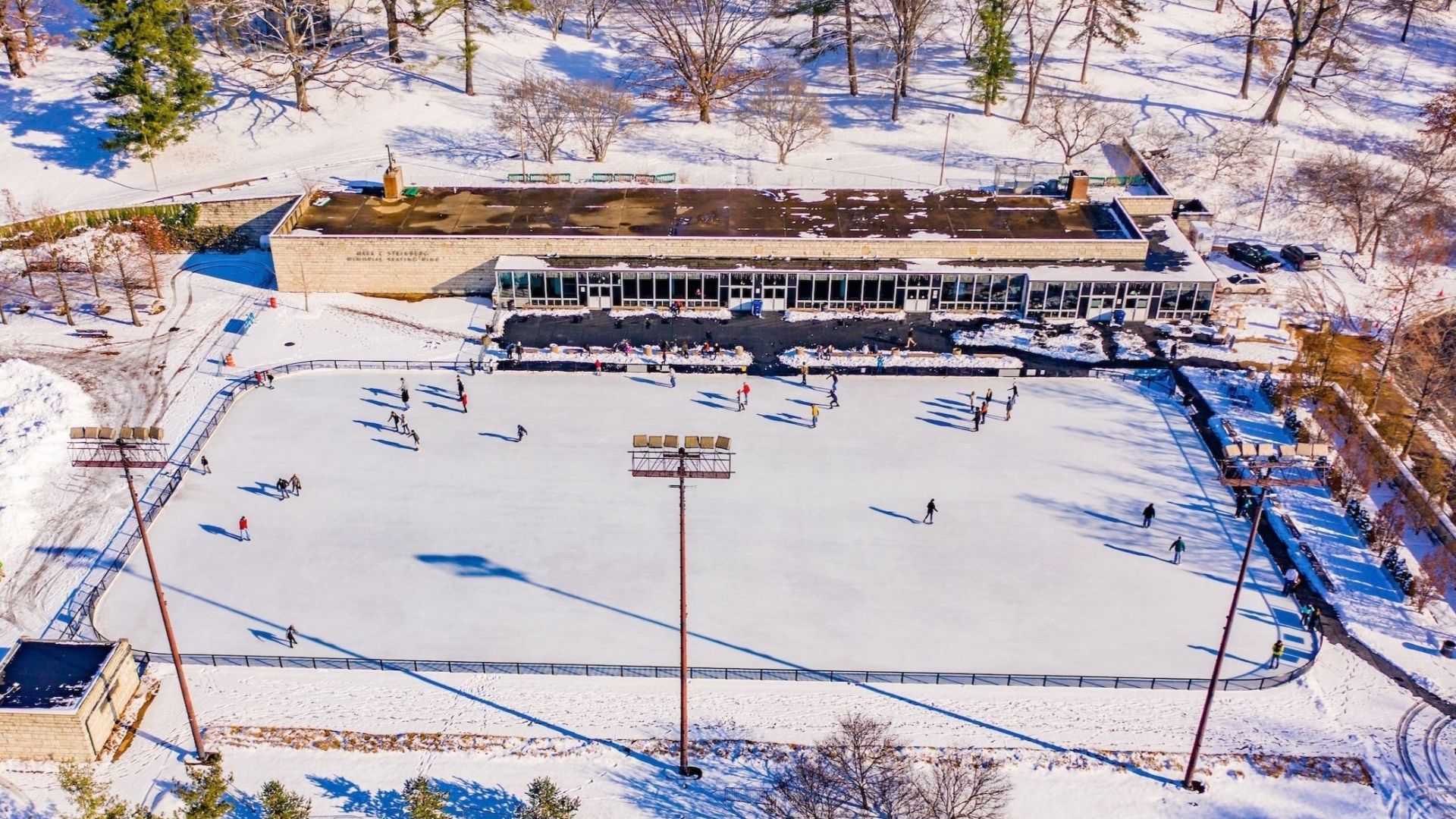 In winter, people zoom around Steinberg Skating Rink in Forest Park.